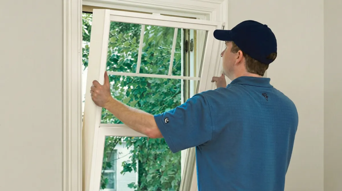 Professional contractors performing a residential window insulation and replacement service in Wilmington, NC